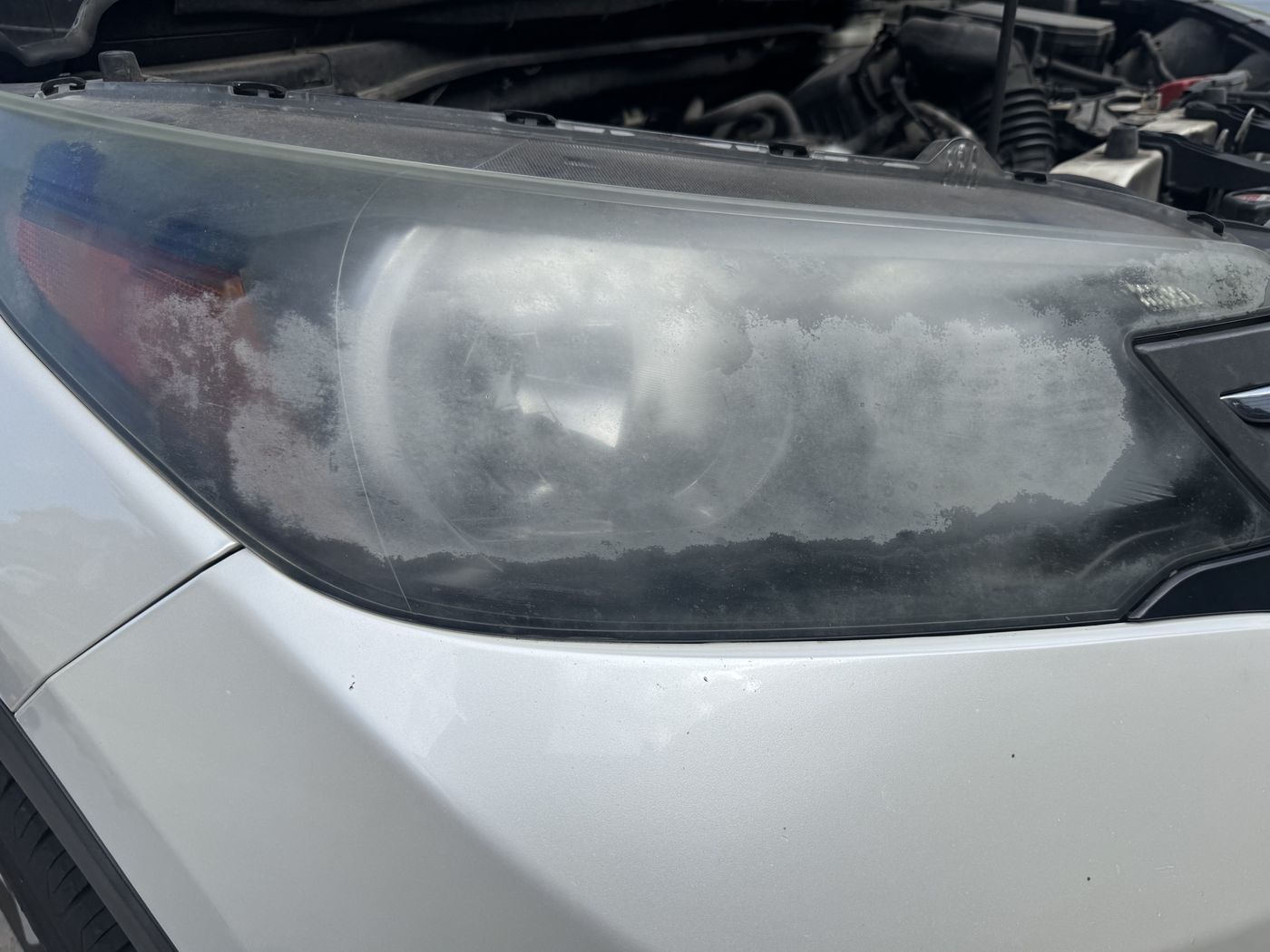 Honda CR-V, heavy chalk-white oxidation before headlight restoration, Utah Valley
