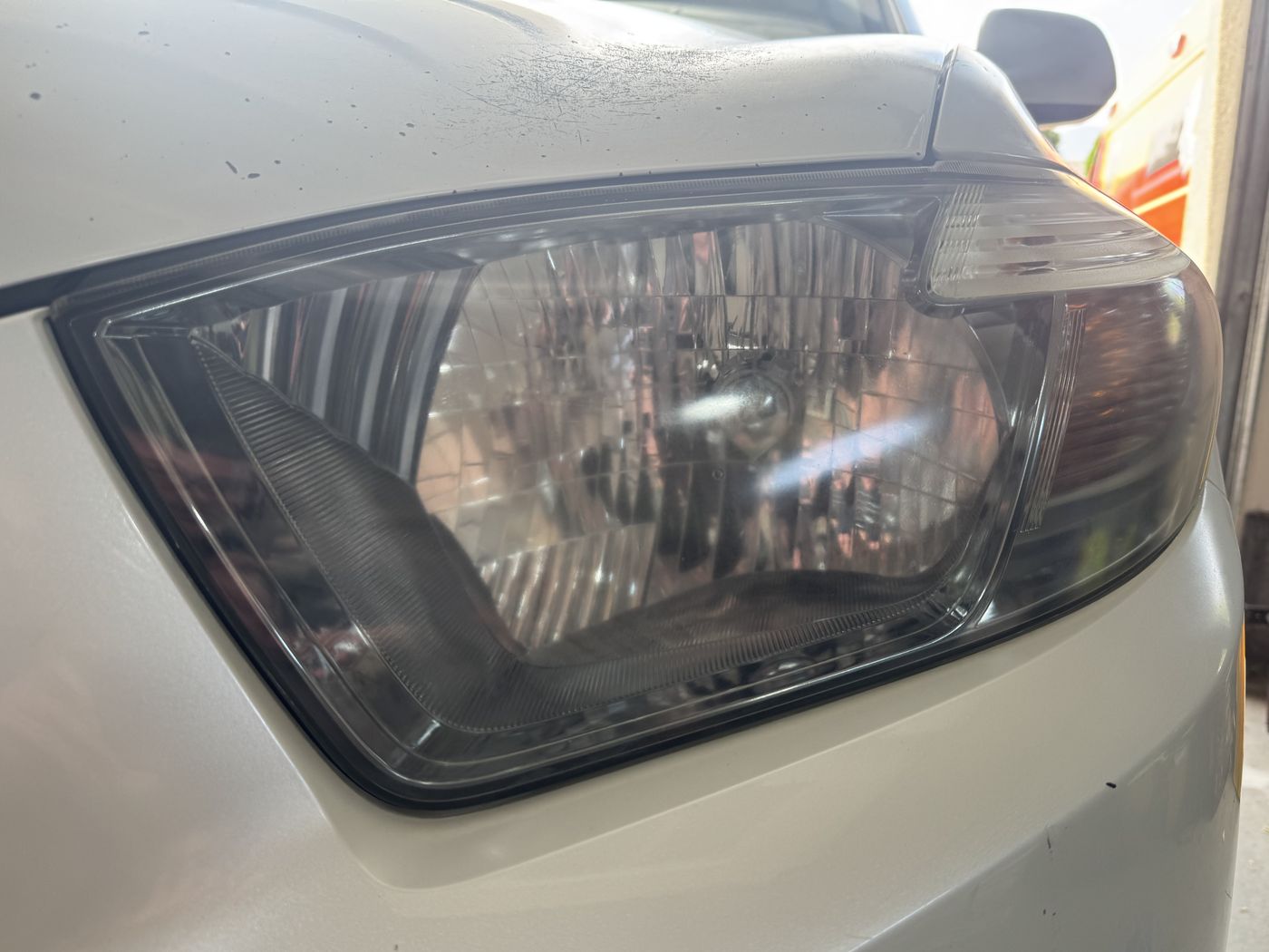 The same Highlander headlight after restoration, crystal clear