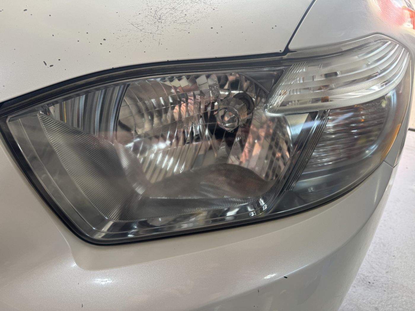 The same headlight lens after restoration, completely clear