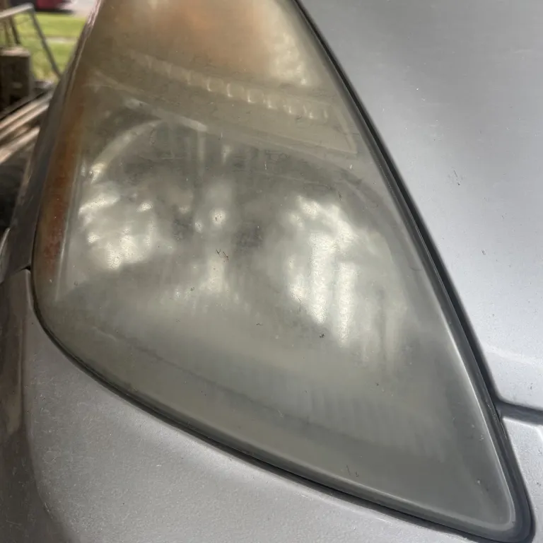 Toyota Prius headlight before restoration, milky and oxidized